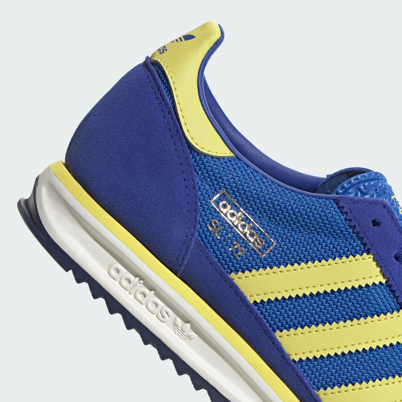 adidas SL 72 RS sneakers with a retro mesh and suede upper, cushioned EVA midsole, and textured outsole for a vintage running-inspired look.