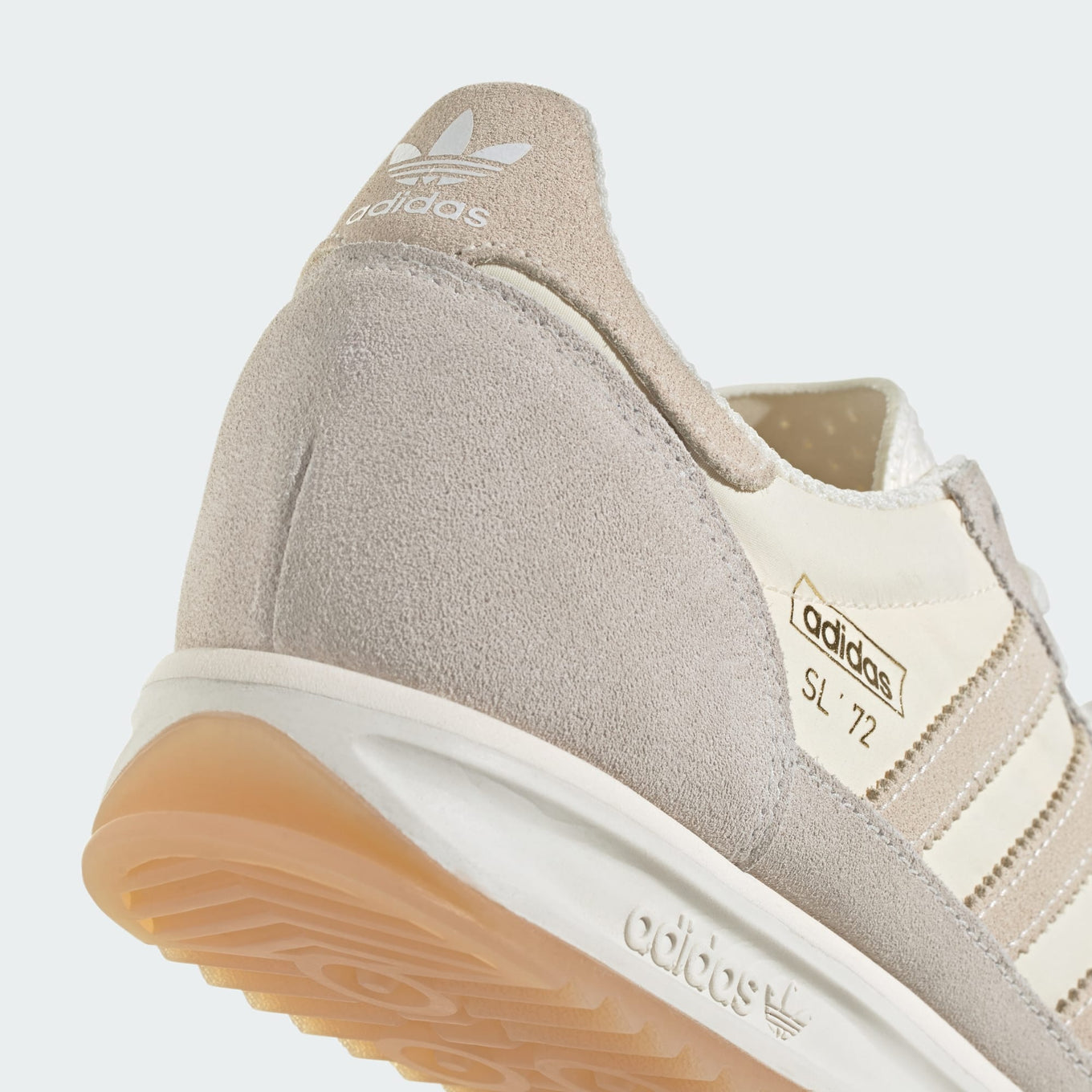 adidas SL 72 shoes with a nylon upper, suede overlays, EVA midsole, and a retro low-cut design.