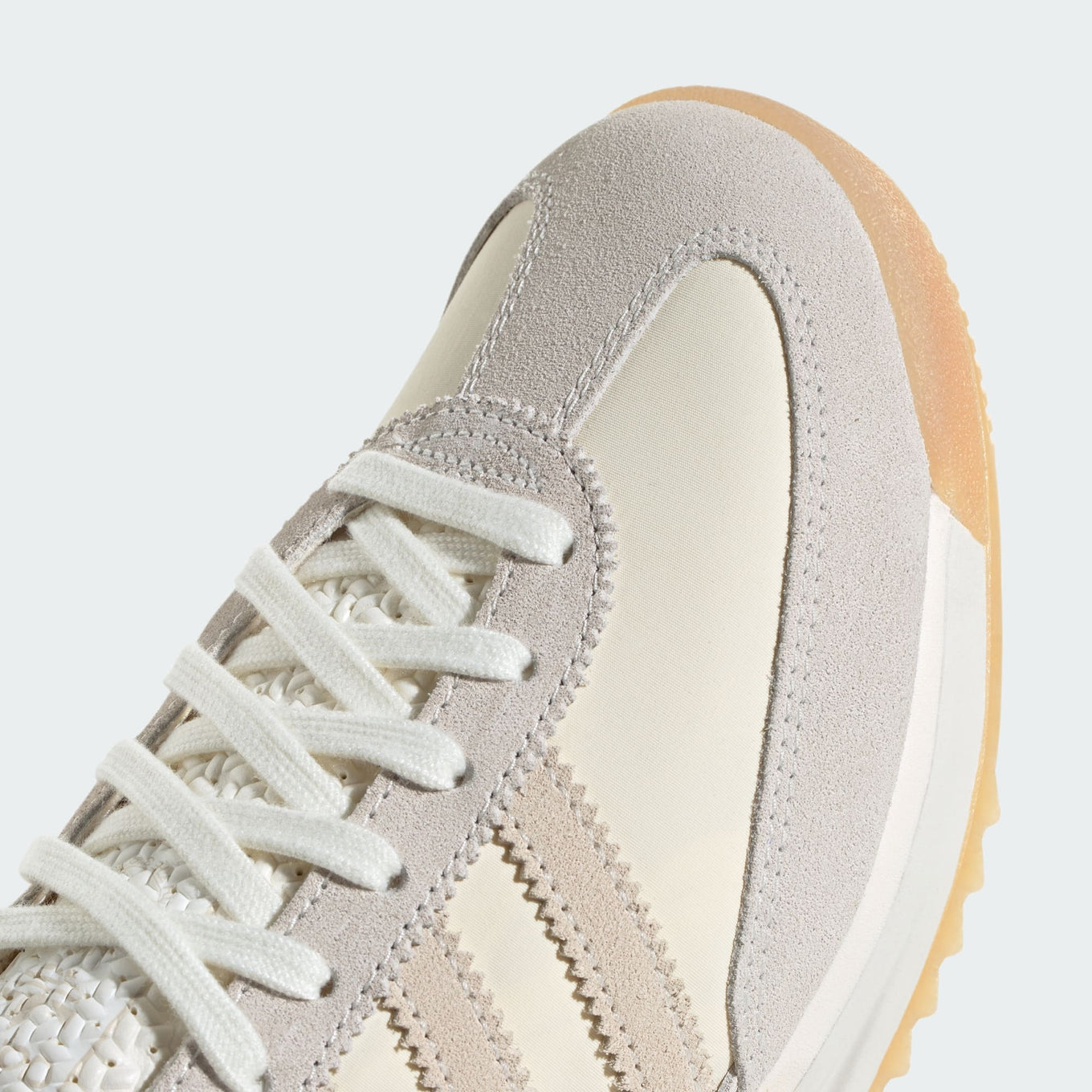 adidas SL 72 shoes with a nylon upper, suede overlays, EVA midsole, and a retro low-cut design.