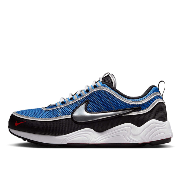 Air Zoom Spiridon sneakers with black, Signal Blue, and University Red colorway, reflective piping, and breathable mesh upper.