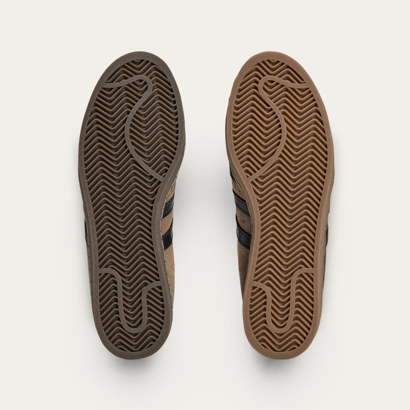 adidas Superstar x Song for the Mute sneakers with a collapsible upper, extended eyelets, and iconic rubber shell toe, blending classic and contemporary design.