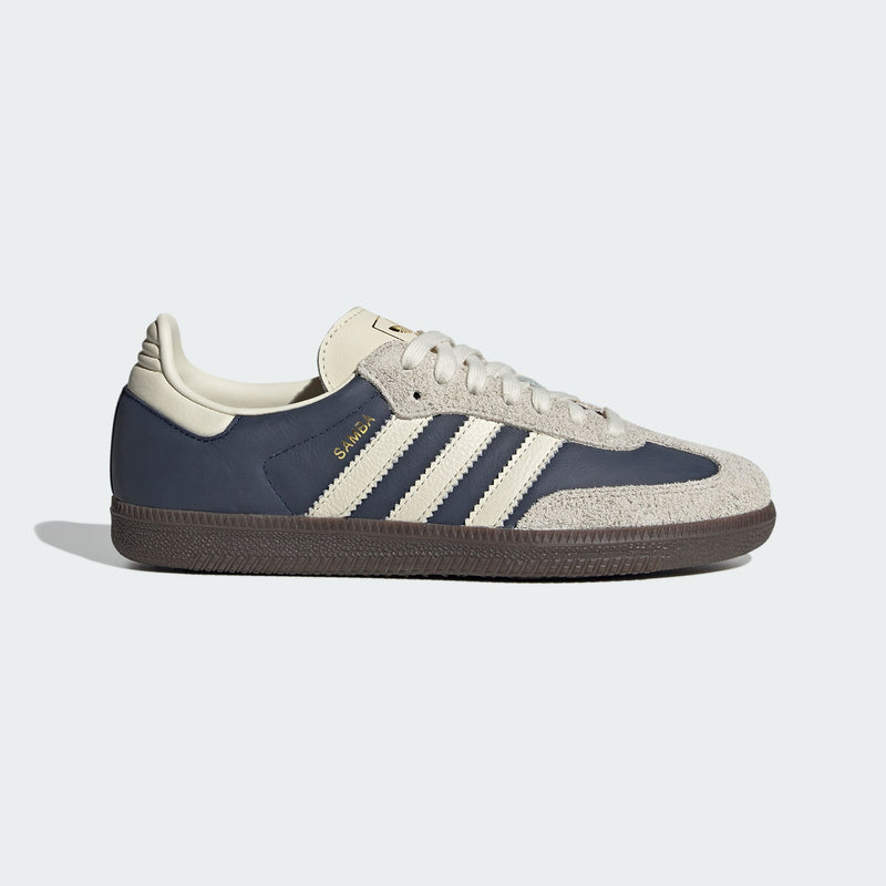 adidas Samba sneakers with premium leather upper, hairy suede accents, and dark gum outsole, showcasing their classic design and gold-printed logo.