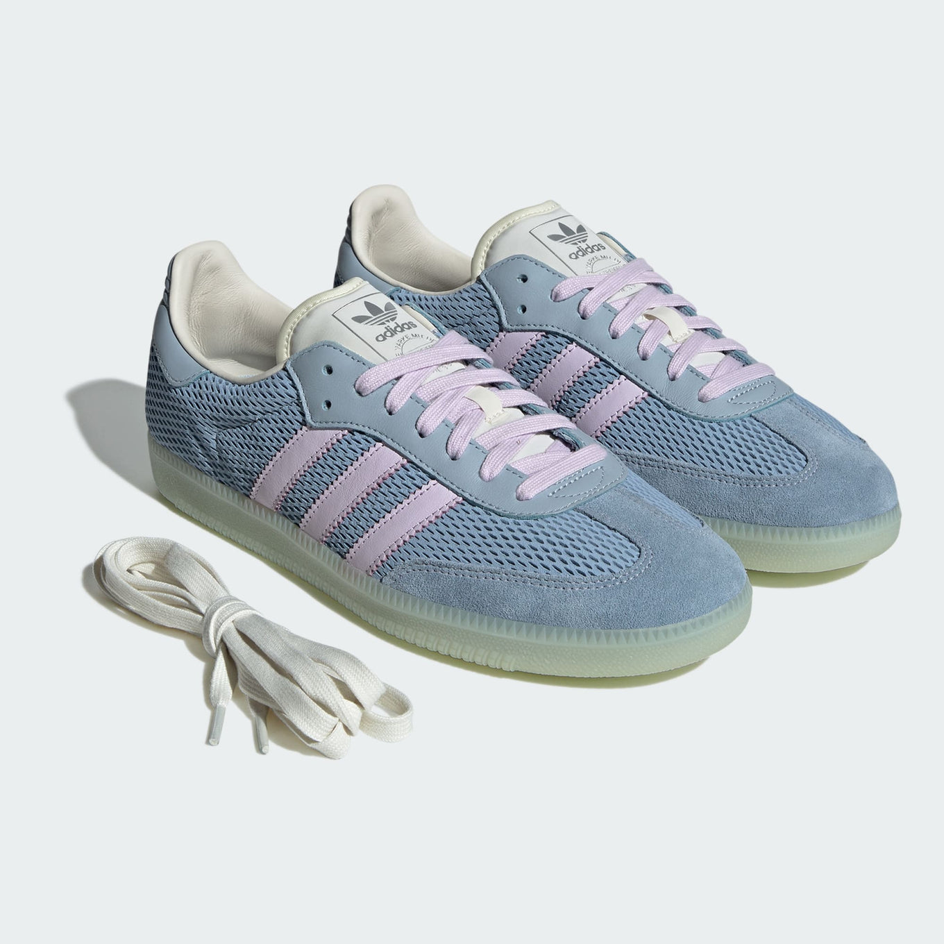 adidas Samba OG sneaker with a mesh-textured leather upper, classic T-toe overlay, and stitched heel tab, embodying vintage style with modern comfort.