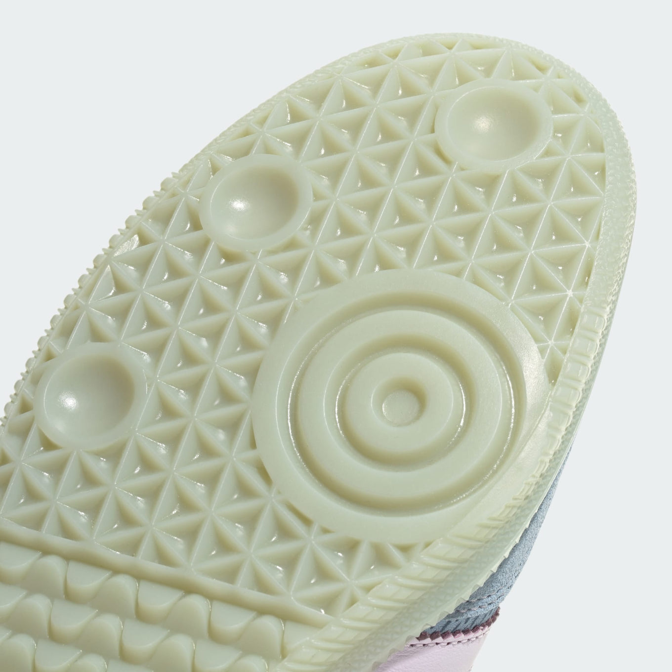 adidas Samba OG sneaker with a mesh-textured leather upper, classic T-toe overlay, and stitched heel tab, embodying vintage style with modern comfort.