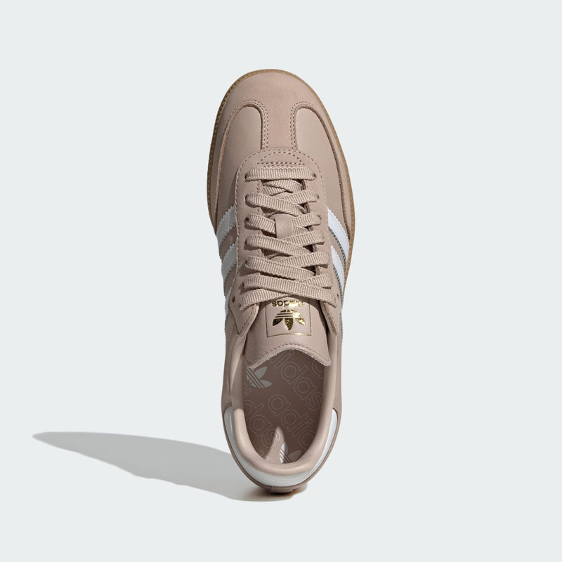 Adidas Samba OG shoes with smooth leather upper and gum rubber outsole, featuring metallic gold accents and serrated 3-Stripes.