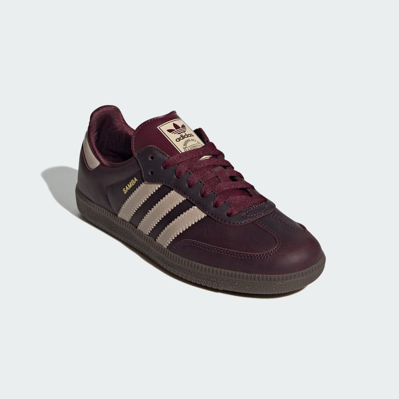 adidas Samba OG shoes in premium leather with shiny accents, showcasing their iconic silhouette and versatile style.


