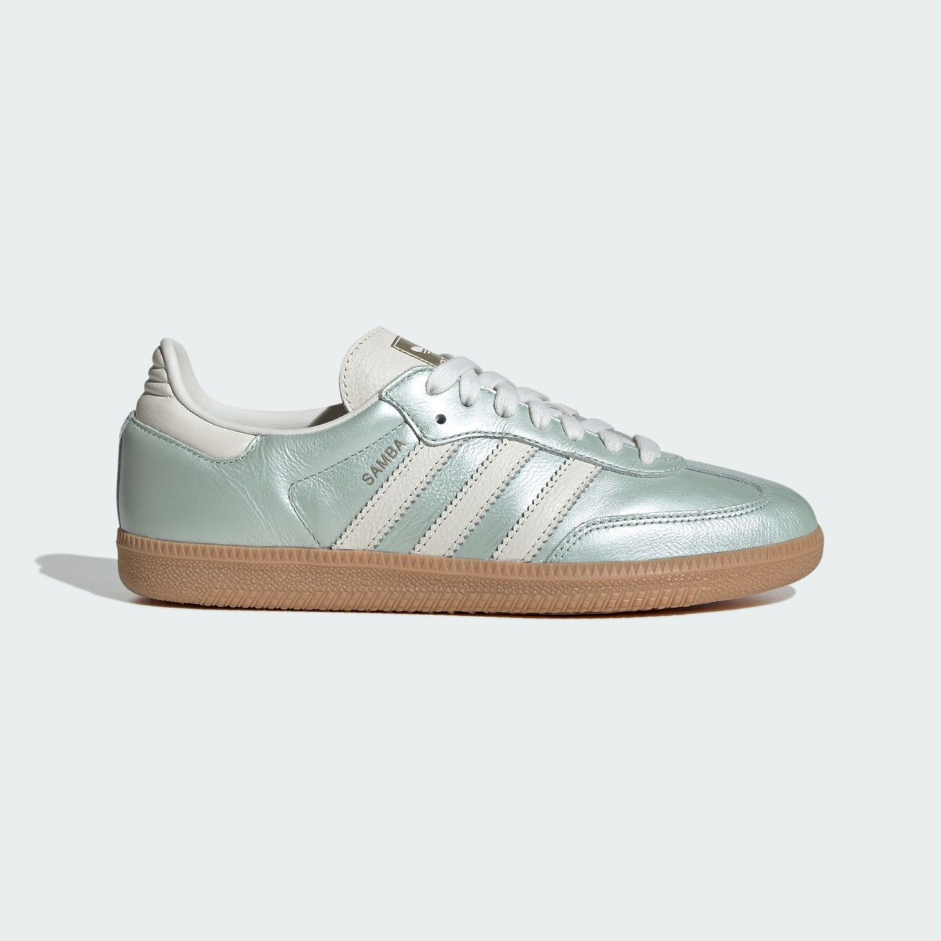 adidas Samba OG shoes with sleek leather upper, durable rubber outsole, and subtle metallic accents.


