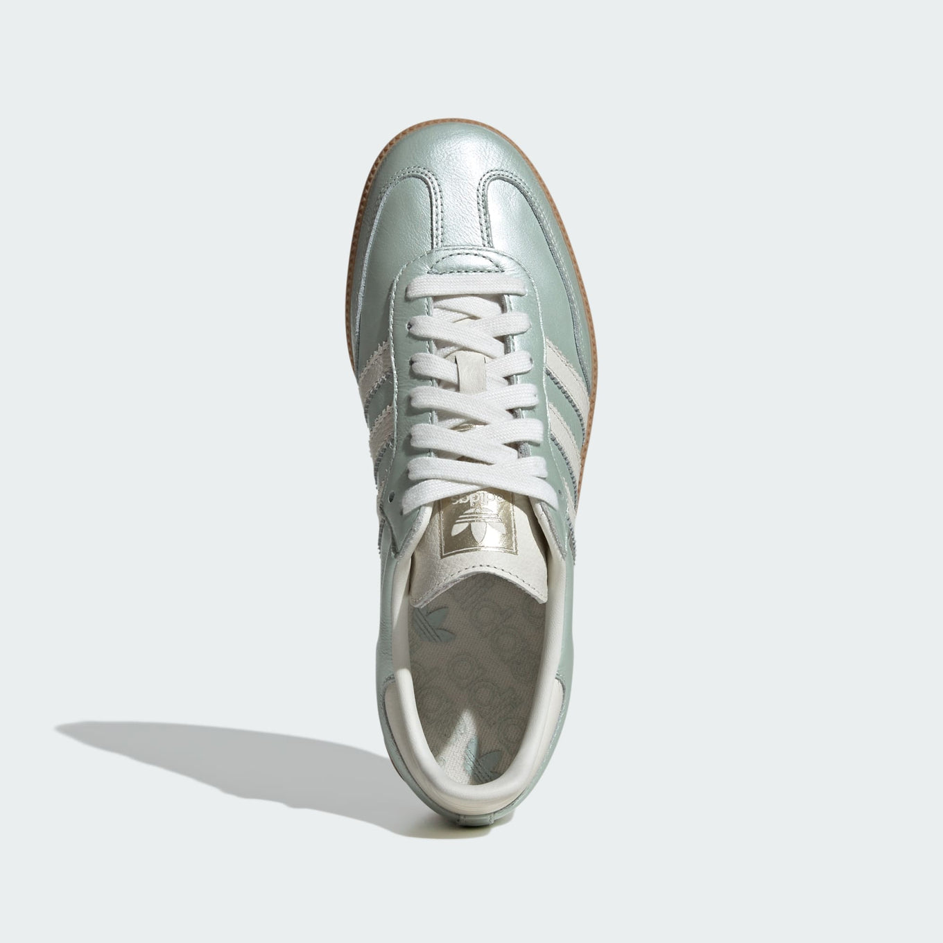 adidas Samba OG shoes with sleek leather upper, durable rubber outsole, and subtle metallic accents.


