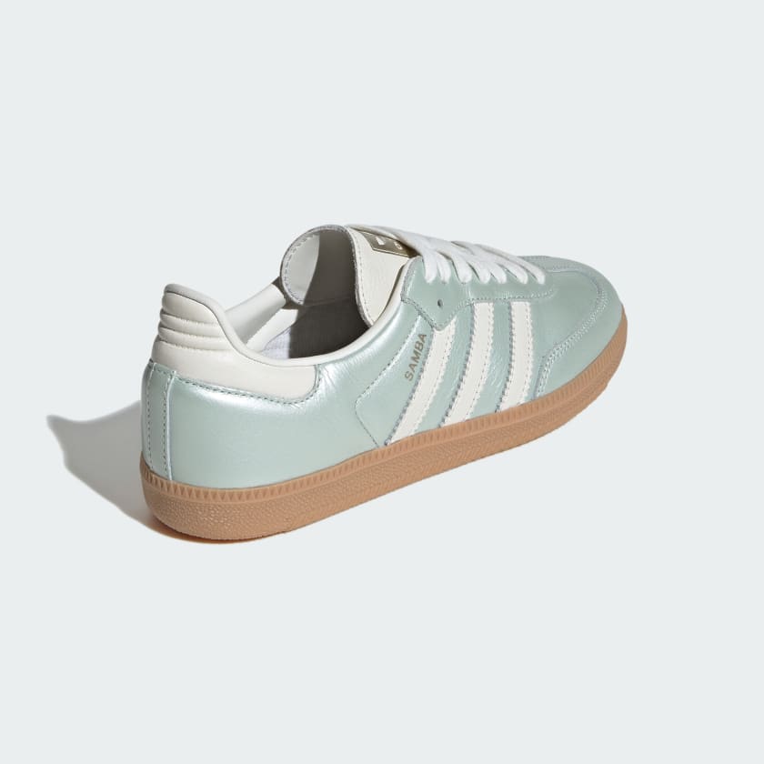 adidas Samba OG shoes with sleek leather upper, durable rubber outsole, and subtle metallic accents.


