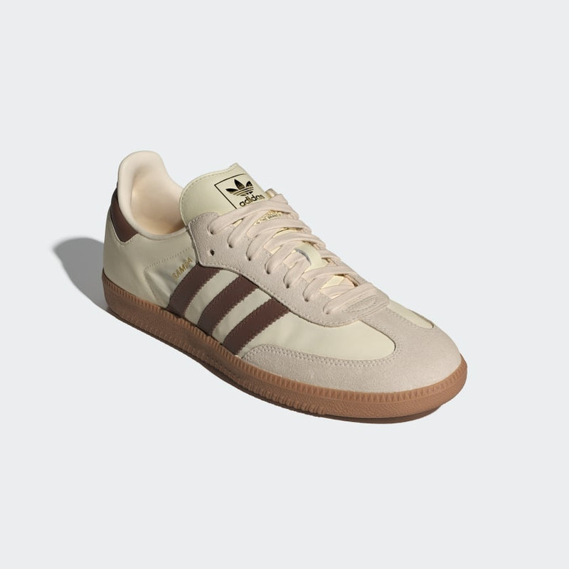 Adidas Samba OG shoes featuring a leather and suede upper, textile lining, and rubber outsole, blending classic design with modern comfort.


