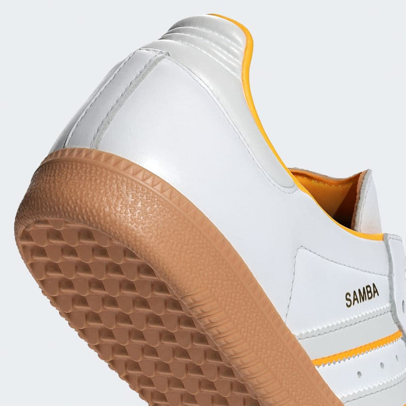 Adidas Samba OG shoes with gum rubber outsole and serrated 3-Stripes, showcasing classic design elements and modern style.