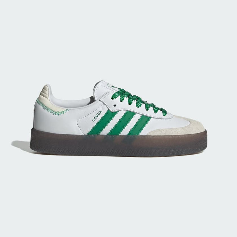 Adidas Sambae shoes with premium leather and synthetic upper, exaggerated midsole, and gum rubber outsole, featuring tongue detail in various languages.


