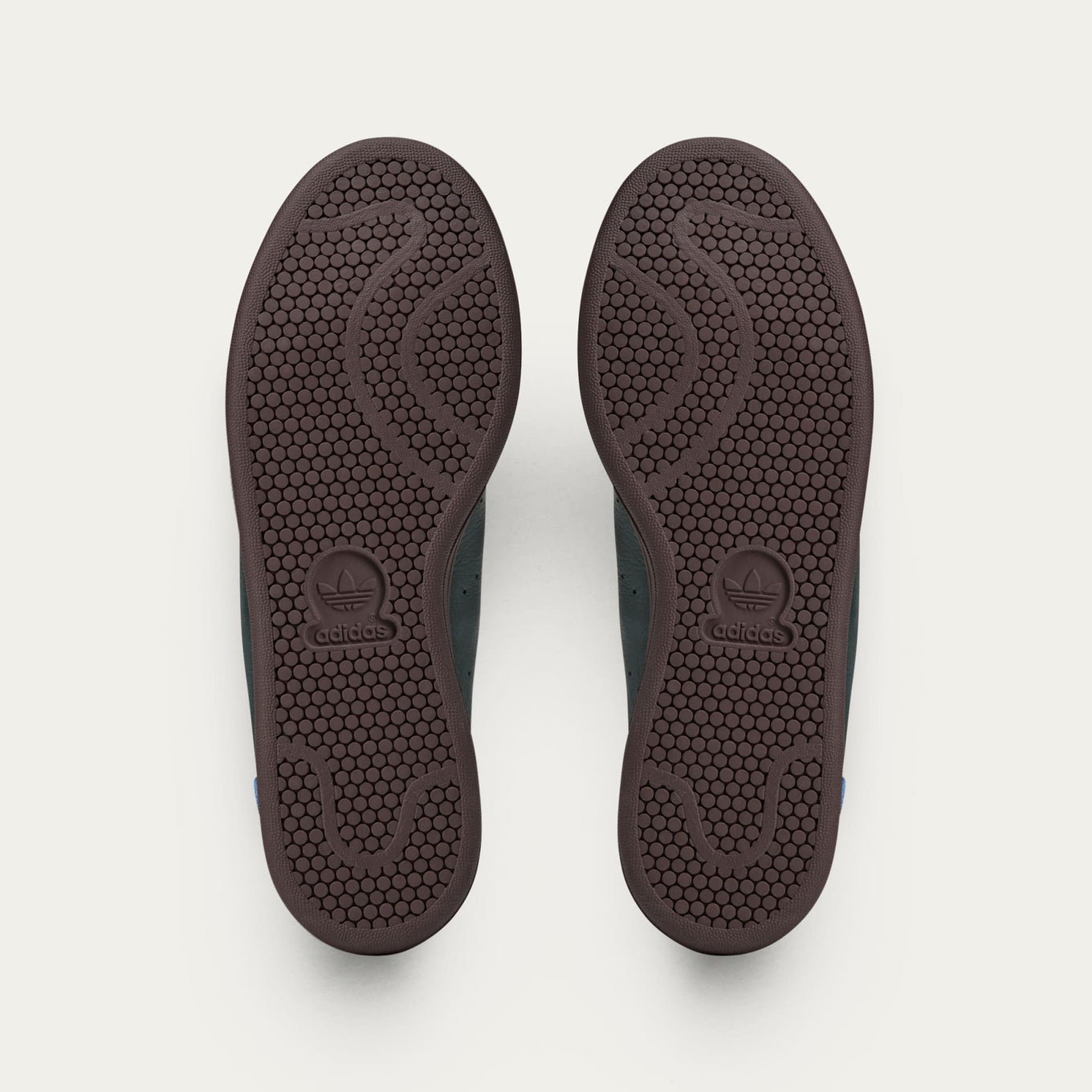 adidas Stan Smith x Brain Dead shoes featuring colorful detailing, custom laces, and unique lace chain accessory.