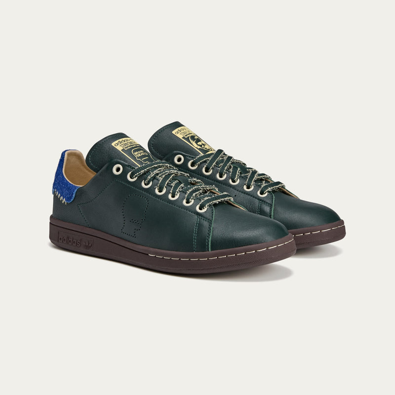 adidas Stan Smith x Brain Dead shoes featuring colorful detailing, custom laces, and unique lace chain accessory.