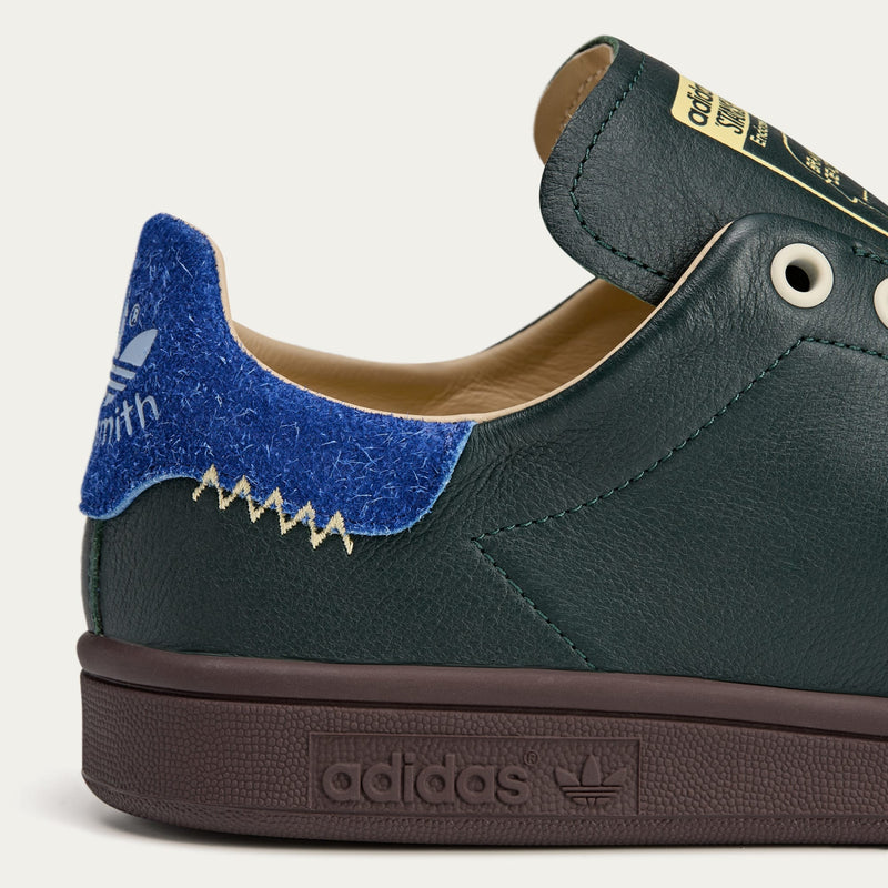 adidas Stan Smith x Brain Dead shoes featuring colorful detailing, custom laces, and unique lace chain accessory.