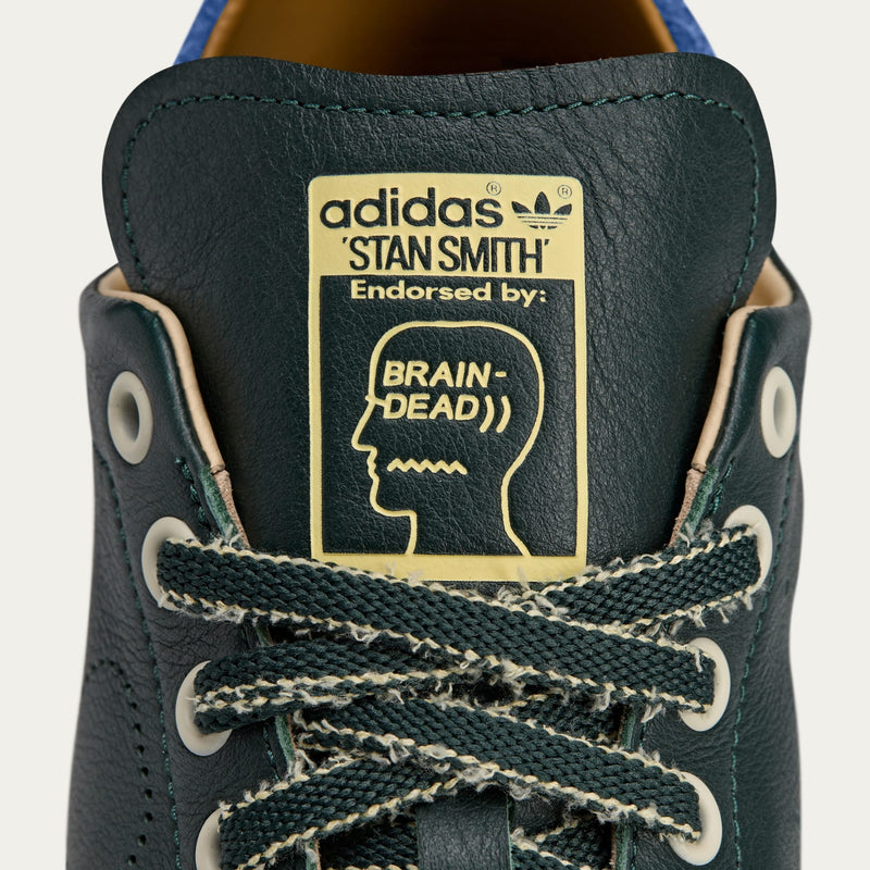 adidas Stan Smith x Brain Dead shoes featuring colorful detailing, custom laces, and unique lace chain accessory.