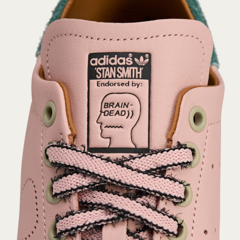 adidas Stan Smith x Brain Dead sneakers with bold color accents, custom laces, and a signature lace chain detail.