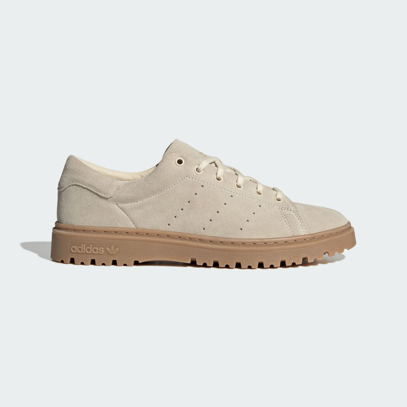 Stan Smith Freizeit sneakers with a suede upper in retro hues, a rugged rubber outsole, and classic Stan Smith branding on the tongue and heel tab.