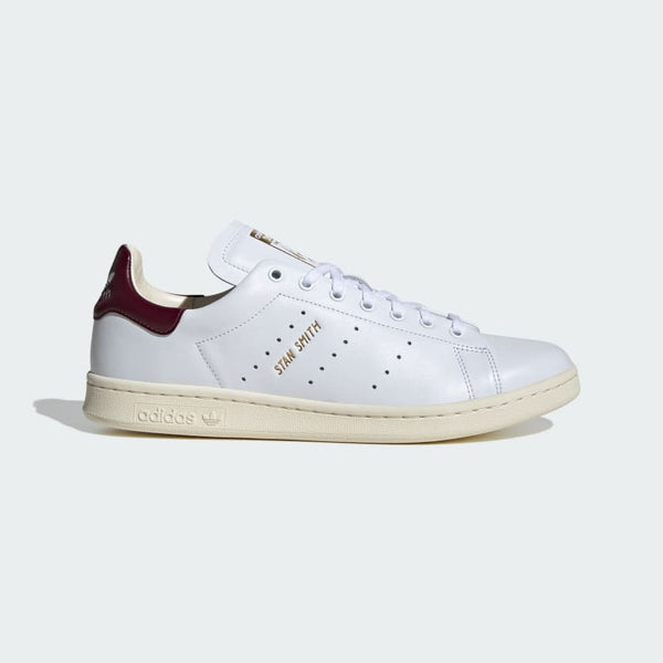 adidas Stan Smith Lux shoes showcasing premium leather craftsmanship with folded edge detailing and reinforced stitching, designed for durability and elegance.


