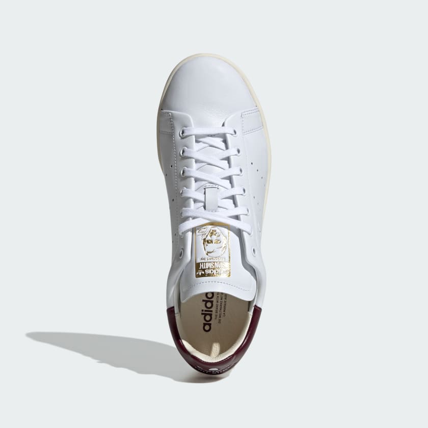 adidas Stan Smith Lux shoes showcasing premium leather craftsmanship with folded edge detailing and reinforced stitching, designed for durability and elegance.


