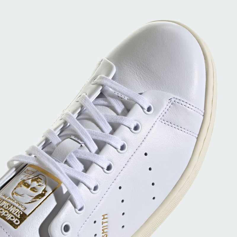 adidas Stan Smith Lux shoes showcasing premium leather craftsmanship with folded edge detailing and reinforced stitching, designed for durability and elegance.


