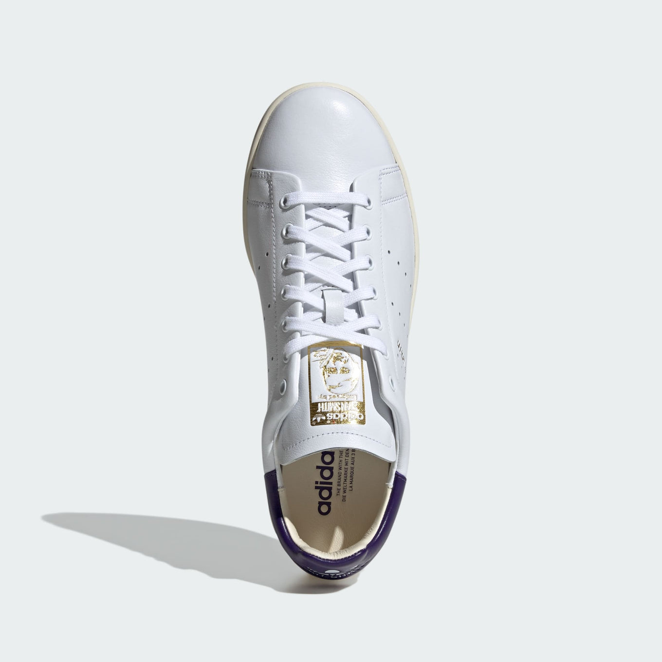 adidas Stan Smith Lux shoes showcasing premium leather craftsmanship with folded edge detailing and reinforced stitching, designed for durability and elegance.



