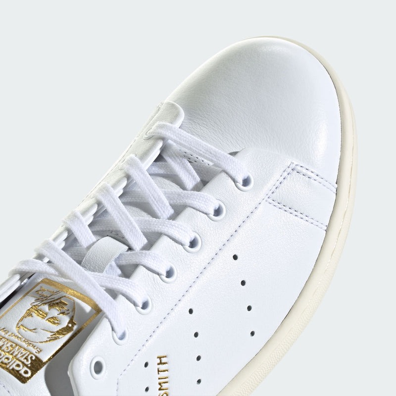 adidas Stan Smith Lux shoes showcasing premium leather craftsmanship with folded edge detailing and reinforced stitching, designed for durability and elegance.


