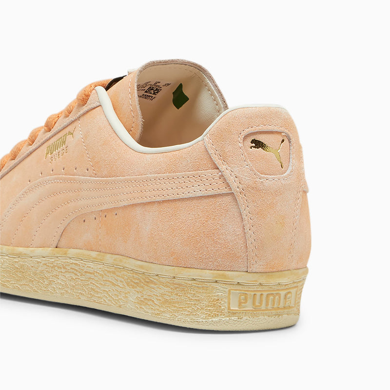 Vintage PUMA Suede sneaker with worn suede upper, honoring its iconic heritage since 1968.