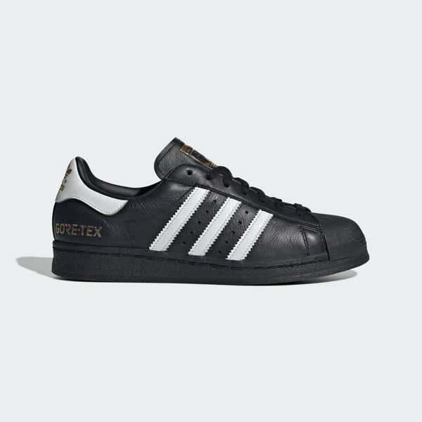 adidas Superstar 82 shoes with iconic shell toe, leather upper, and durable rubber outsole. 