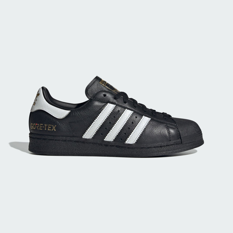 adidas Superstar 82 shoes with iconic shell toe, leather upper, and durable rubber outsole. 