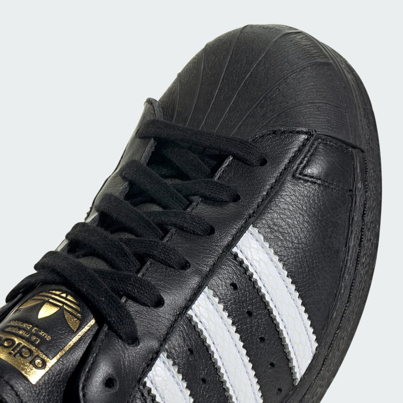 adidas Superstar 82 shoes with iconic shell toe, leather upper, and durable rubber outsole