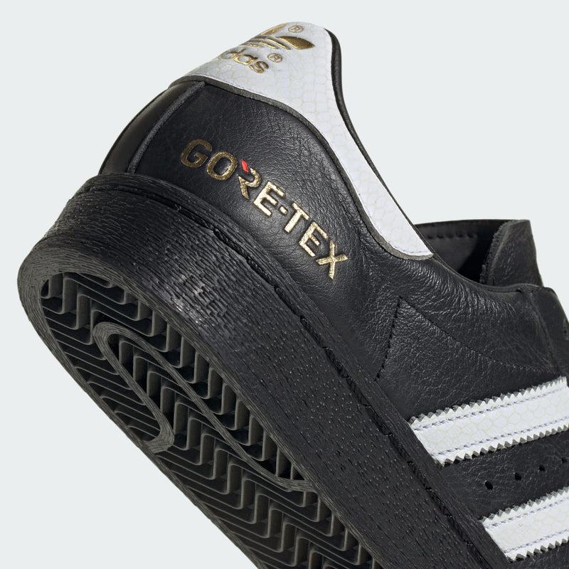 adidas Superstar 82 shoes with iconic shell toe, leather upper, and durable rubber outsole