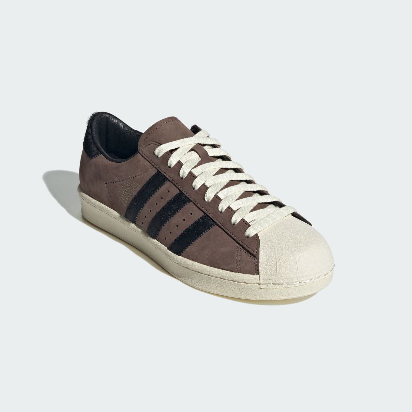 adidas Superstar shoes with premium nubuck upper, pony hair 3-Stripes and heel, and classic shell toe design