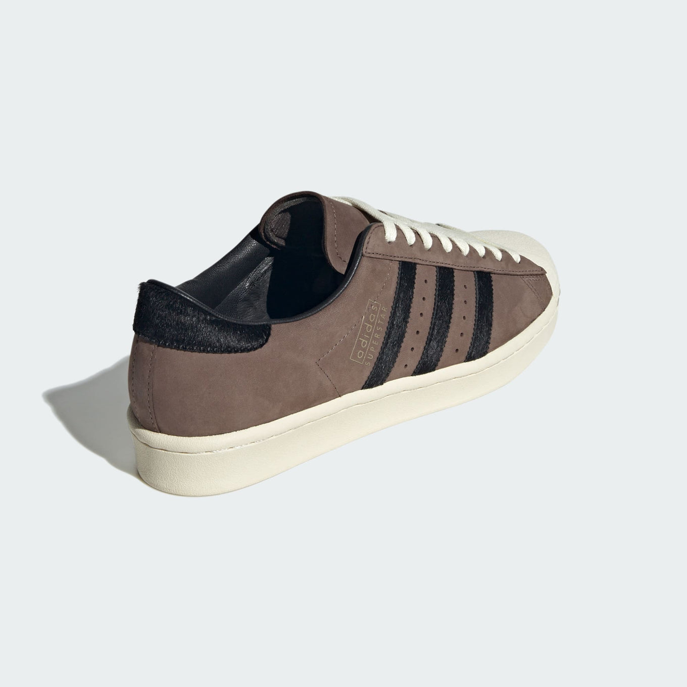 adidas Superstar shoes with premium nubuck upper, pony hair 3-Stripes and heel, and classic shell toe design