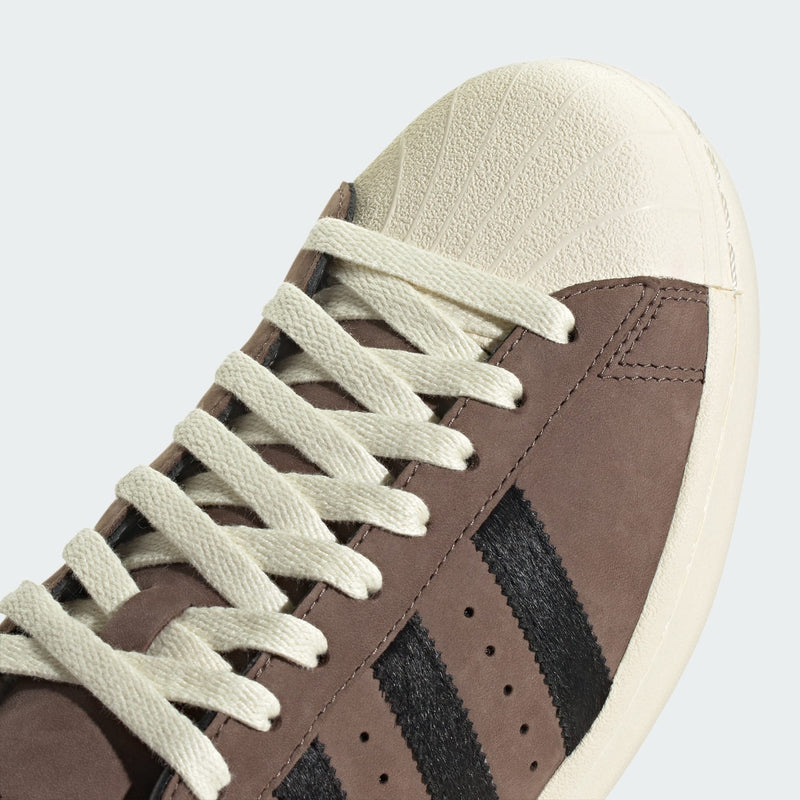 adidas Superstar shoes with premium nubuck upper, pony hair 3-Stripes and heel, and classic shell toe design