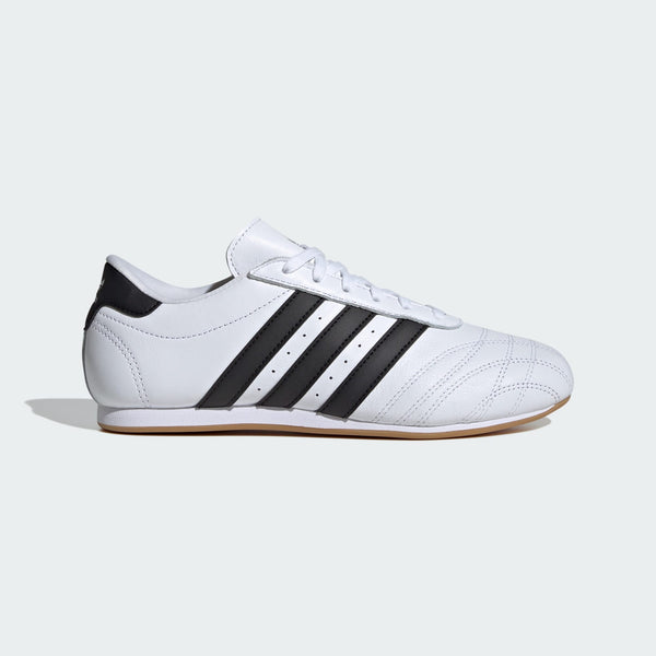 Sleek adidas trainers with minimalist design, soft leather, quilted toes, and classic 3-Stripes.