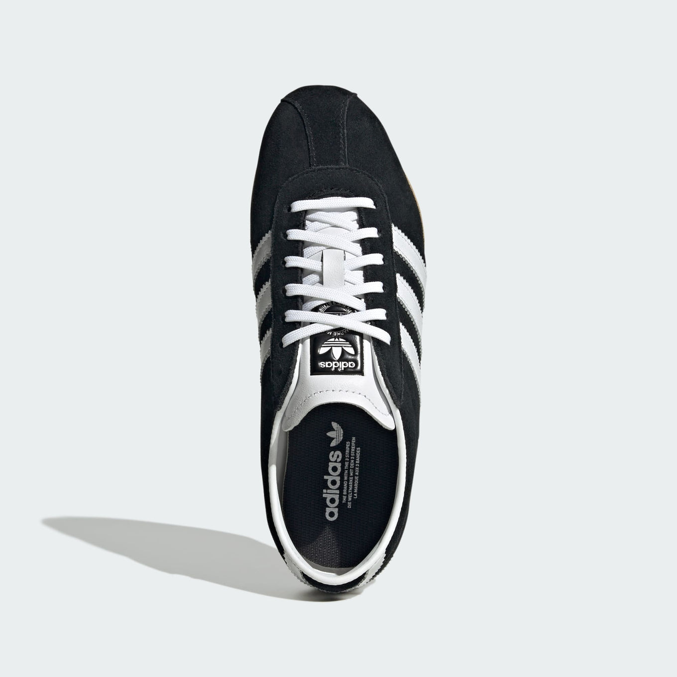 adidas Tokyo shoes with a suede upper, slim silhouette, and rubber outsole, combining retro-inspired design with everyday comfort.