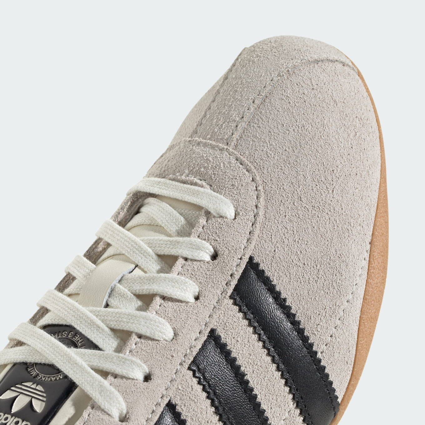 adidas Tokyo shoes with a soft suede upper, slim profile, and rubber outsole, blending retro aesthetics with modern comfort.