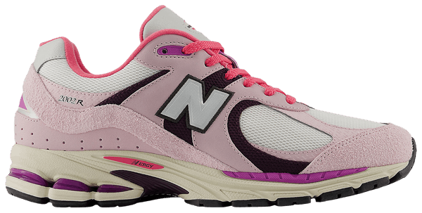New Balance 2002R sneakers in Passion Fruit and Dragon Berry colorways with suede and mesh upper and ABZORB midsole.