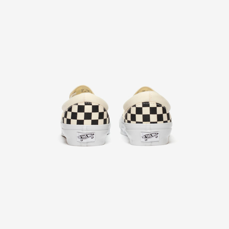 Premium Slip-On 98 Shoes featuring a checkerboard print, full-grain leather collar lining, gloss-finished sidewalls, and Sola Foam All-Day-Comfort.