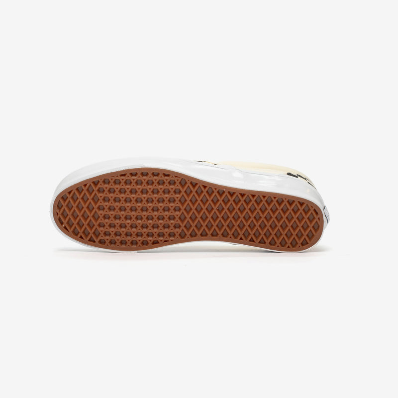 Premium Slip-On 98 Shoes featuring a checkerboard print, full-grain leather collar lining, gloss-finished sidewalls, and Sola Foam All-Day-Comfort.