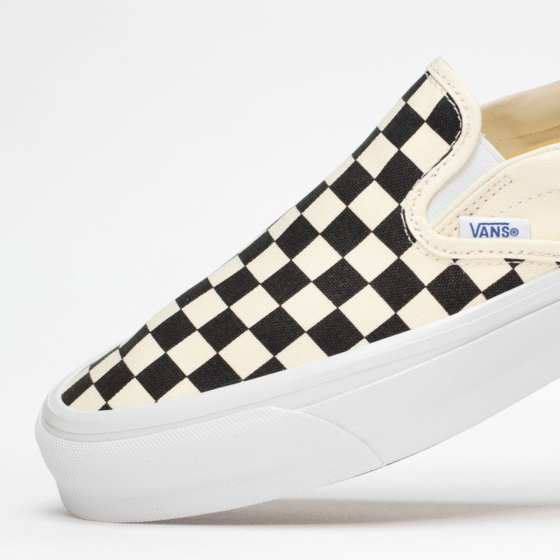 Premium Slip-On 98 Shoes featuring a checkerboard print, full-grain leather collar lining, gloss-finished sidewalls, and Sola Foam All-Day-Comfort.