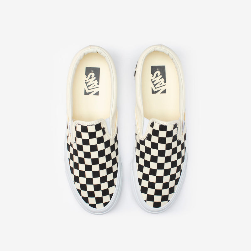 Premium Slip-On 98 Shoes featuring a checkerboard print, full-grain leather collar lining, gloss-finished sidewalls, and Sola Foam All-Day-Comfort.