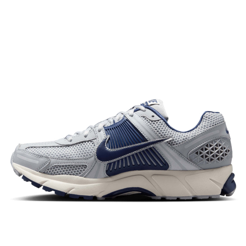 Zoom Vomero 5 with layered textiles, suede accents, Zoom Air cushioning, and breathable design.