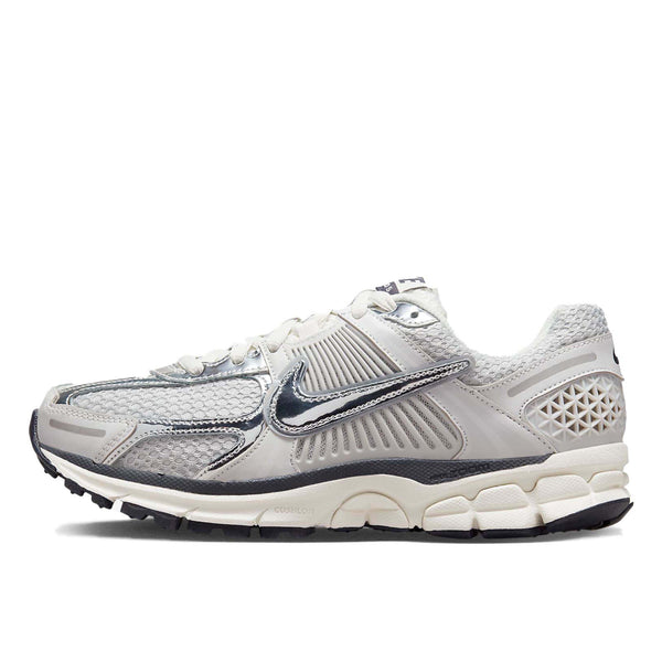 Nike Zoom Vomero 5 sneaker in neutral colorway with layered textures and metallic Swoosh detailing