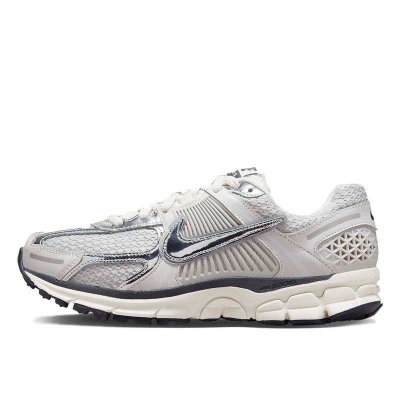 Nike Zoom Vomero 5 sneaker in neutral colorway with layered textures and metallic Swoosh detailing