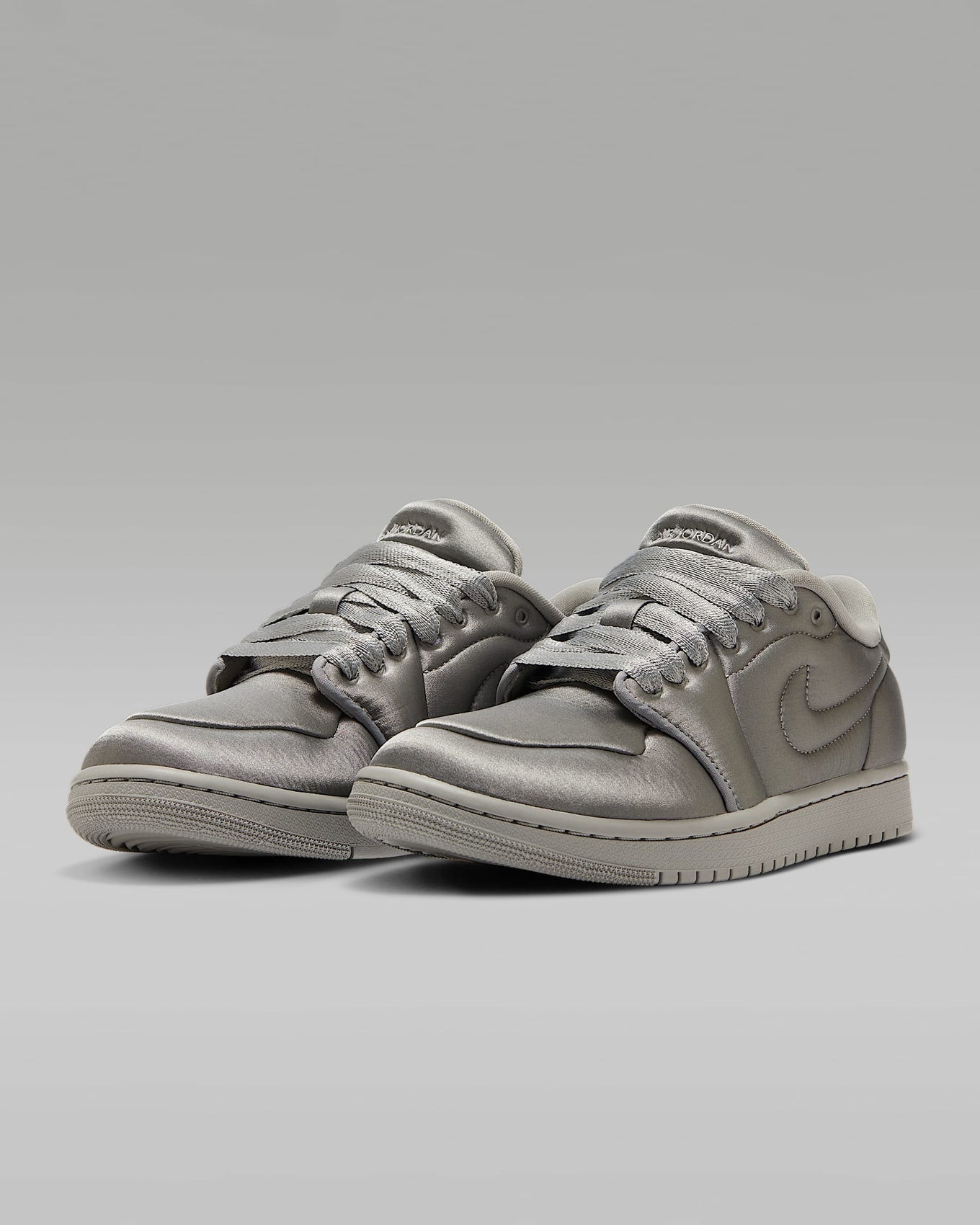 Air Jordan 1 ‘Method of Make’ sneaker with a monochromatic satin design, color-matched details, and a luxurious finish.







