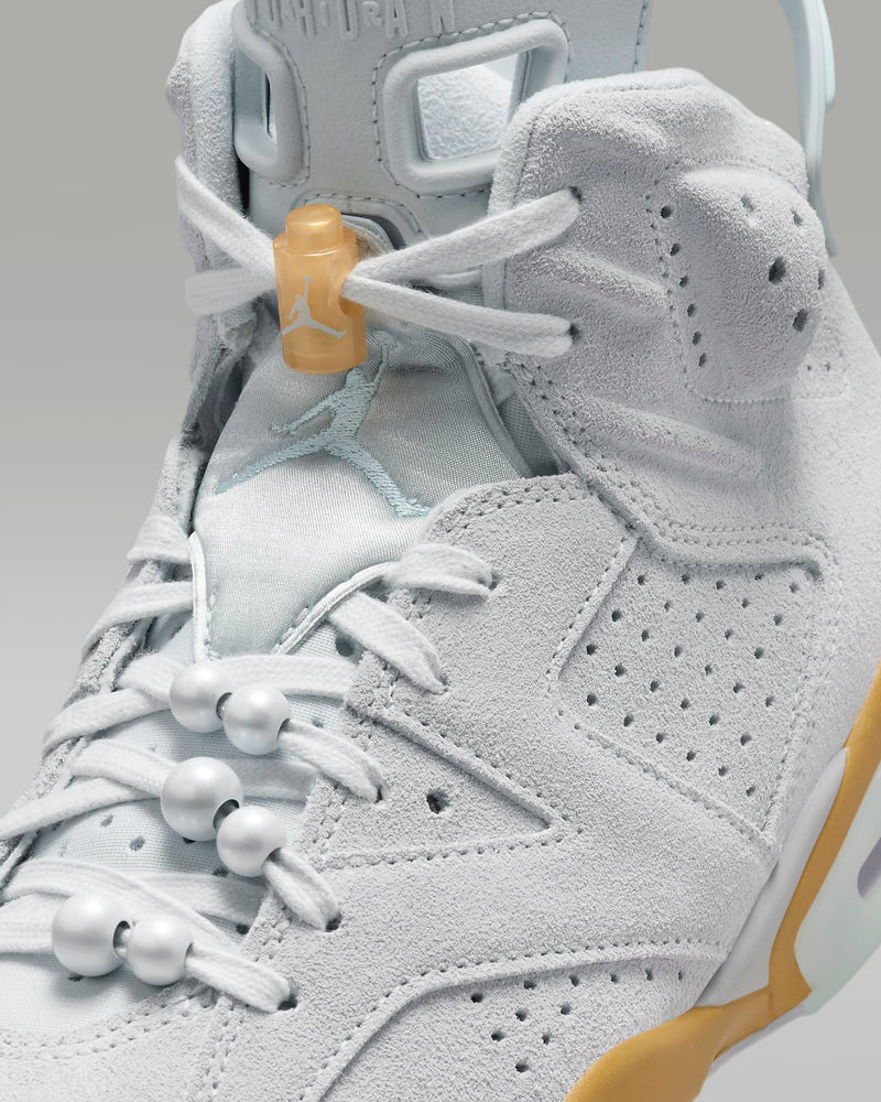 Air Jordan 6 Retro sneaker featuring premium materials and an iconic translucent outsole, recreating the design from the year MJ won his first championship ring.



