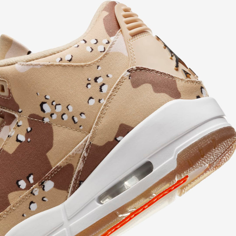 Desert Camo edition of the AJ3 sneakers with textured textile upper, raised Jumpman logo on tongue, Brilliant Orange accents on sole, and matching dog tag for laces