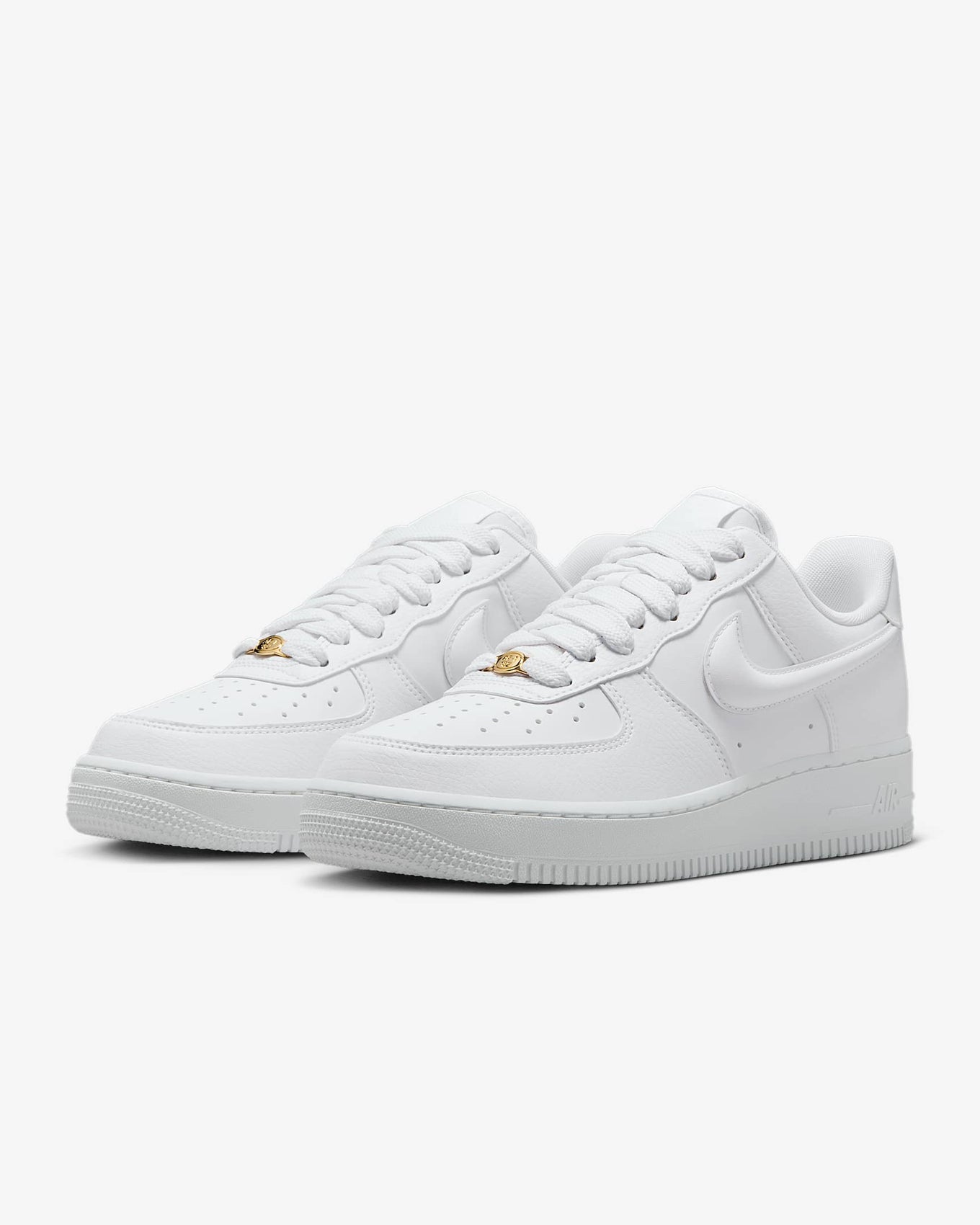 Nike Air Force 1 sneaker with classic ‘80s design, puffy Swoosh logo, and metal dubrae for a timeless and stylish look.